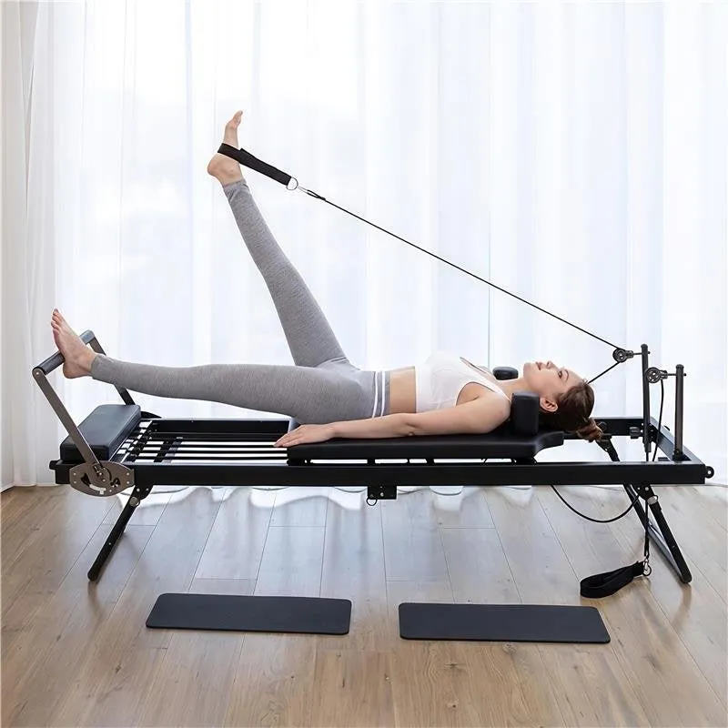 Stokomani Jeux Reformer table de pilates pliable 120 kg rails alu